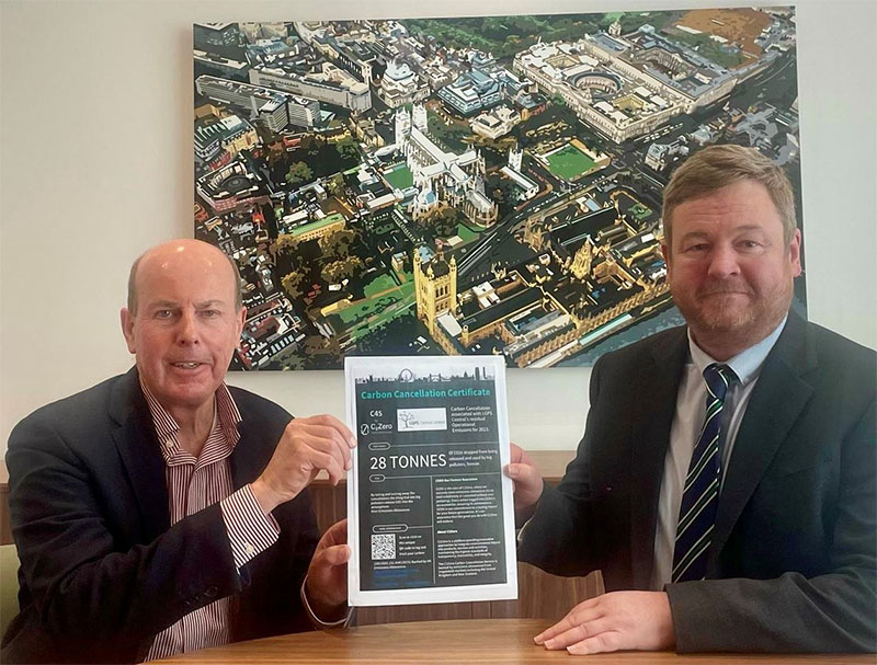 Martin Bellamy (C2Zero) presents the initial carbon cancellation certificate to Patrick O’Hara (LGPS Central).